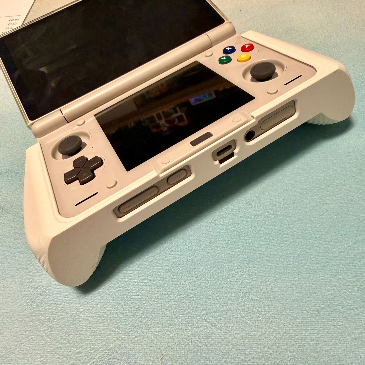 AYN Thor ergonomic 3D printed grip installed on handheld console