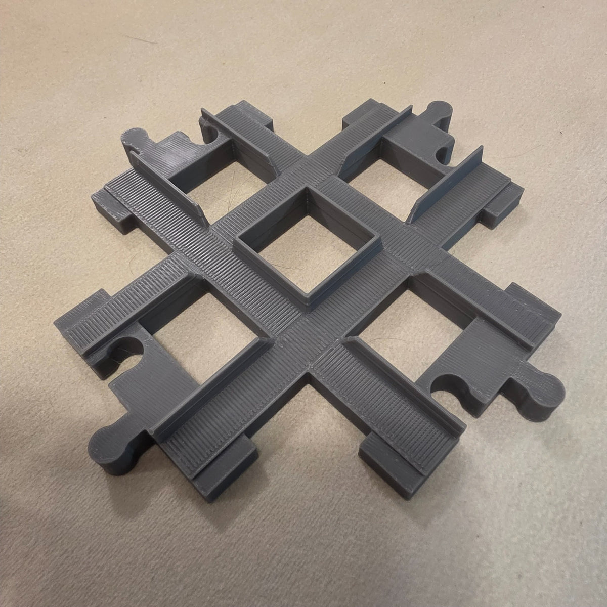 Compatible DUPLO-style multi-way train track crossing