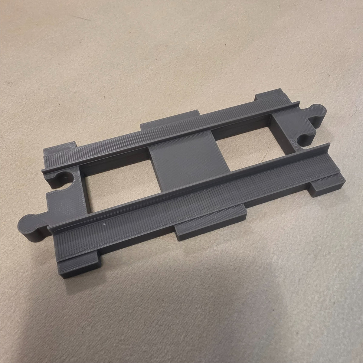 Compatible DUPLO-style replacement train track piece