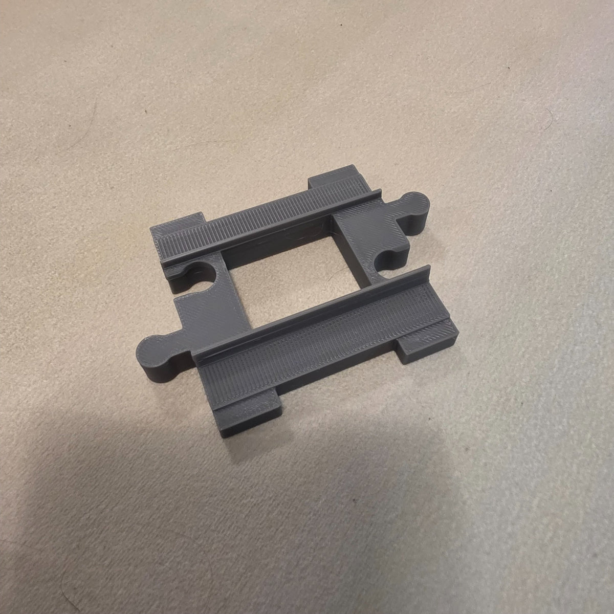 Compatible DUPLO-style replacement train track piece