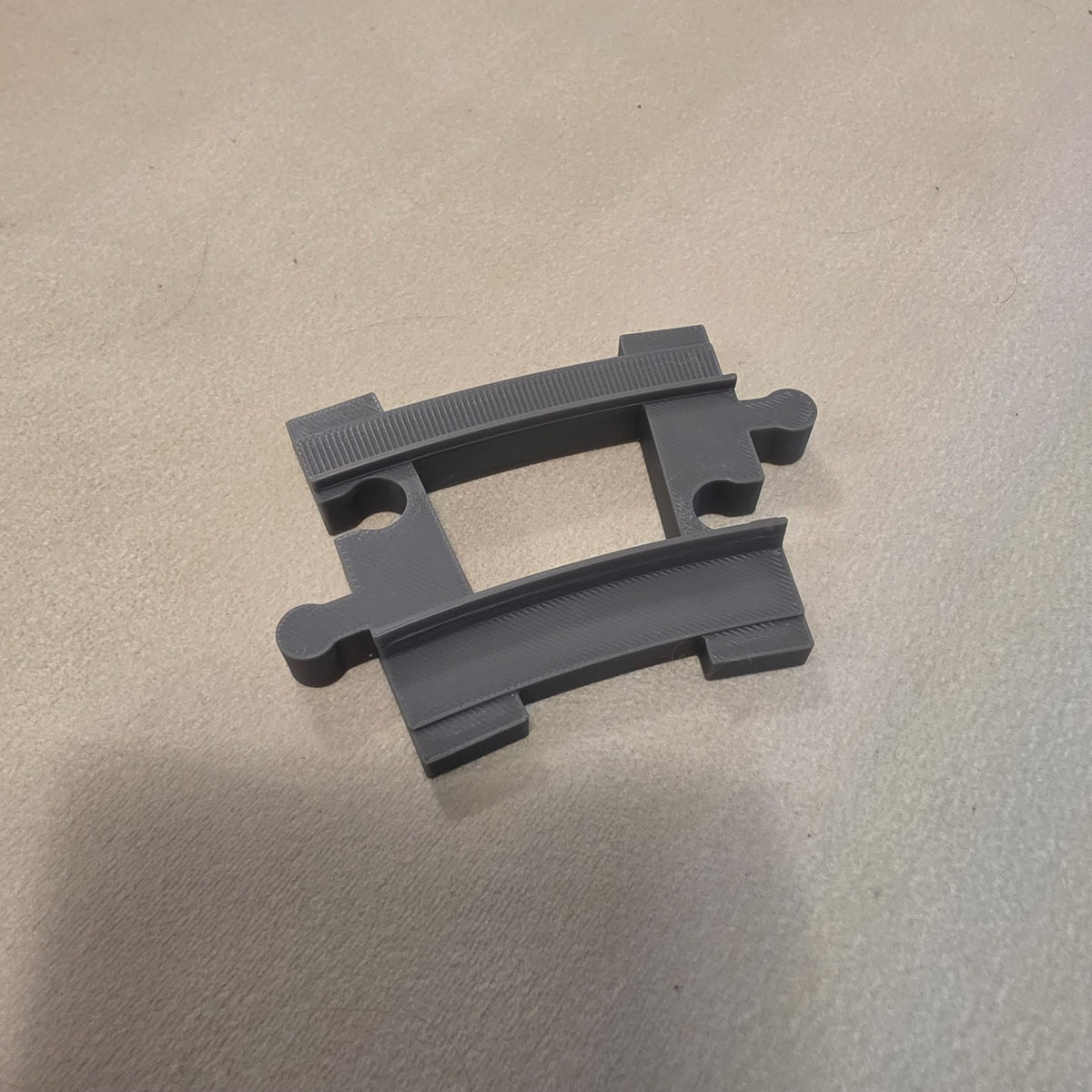 Compatible DUPLO-style replacement train track piece