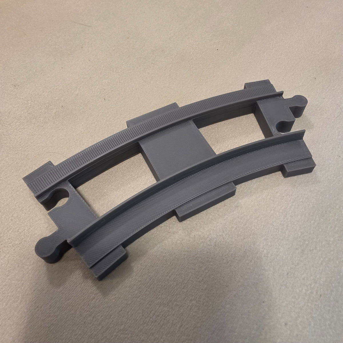 Compatible DUPLO-style replacement train track piece