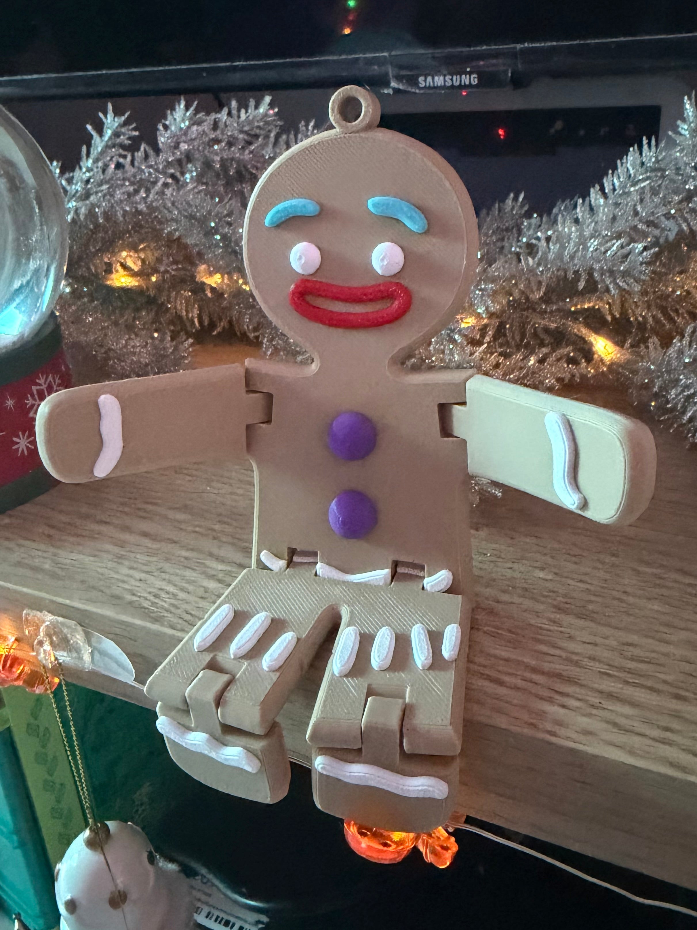 Articulated gingerbread man Christmas fidget decoration seated view