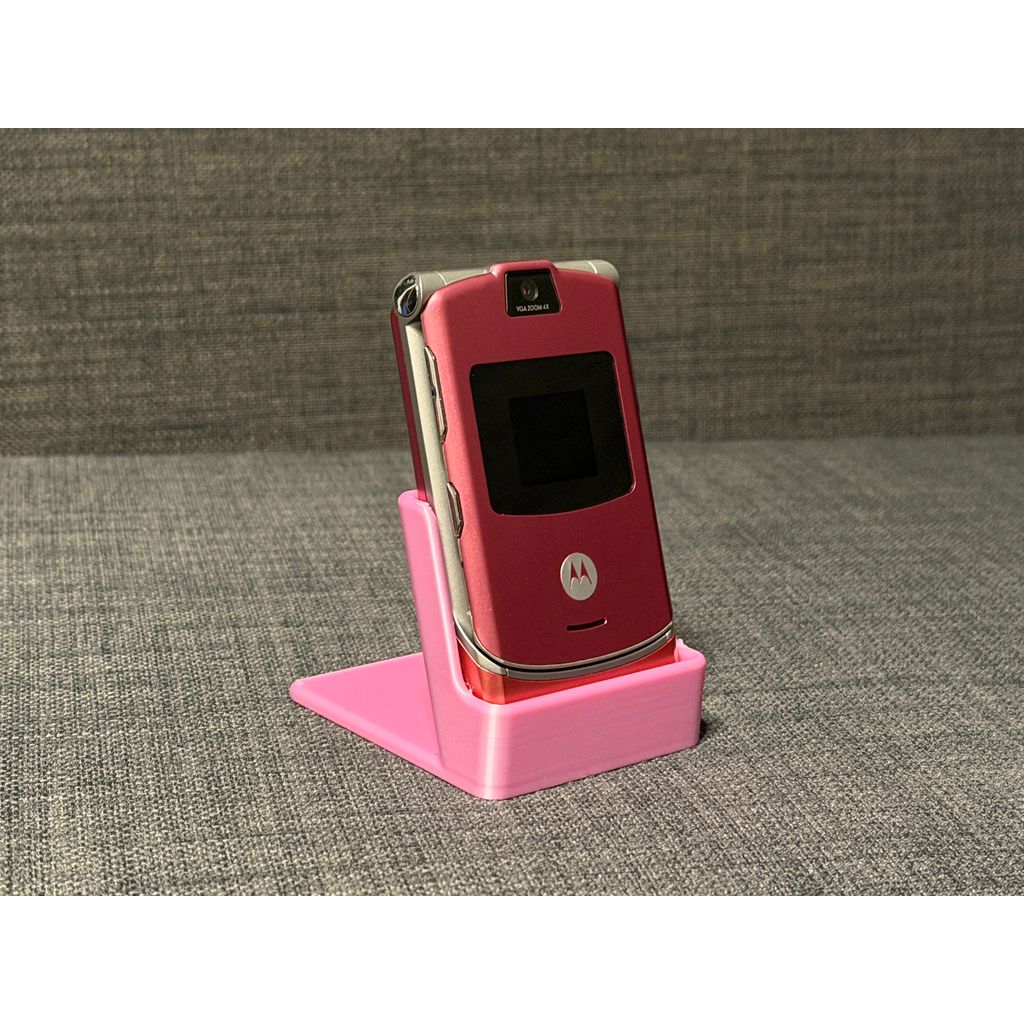 Motorola RAZR V3 displayed closed in a pink 3D printed stand