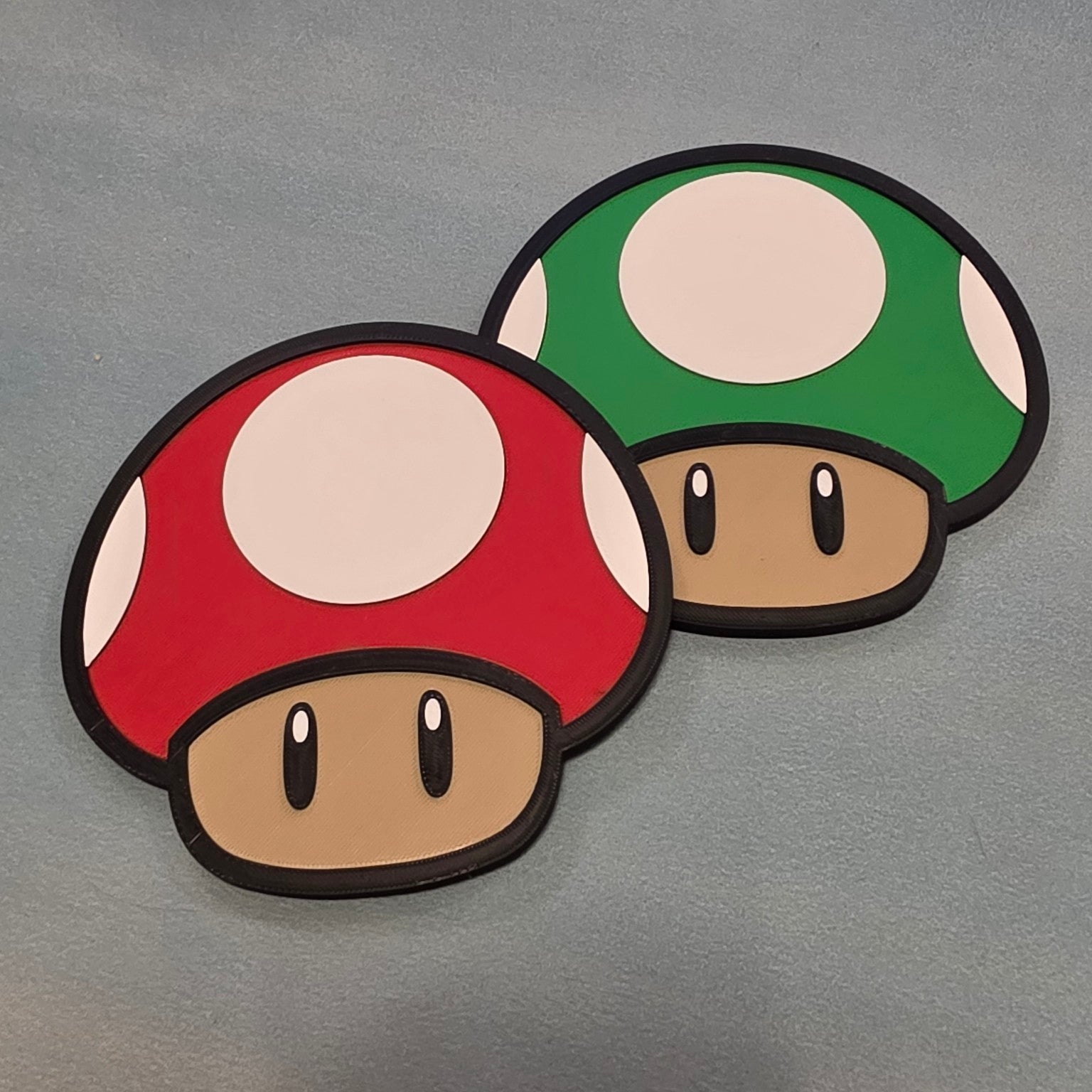 Red and green mushroom inspired 3D printed gaming wall signs