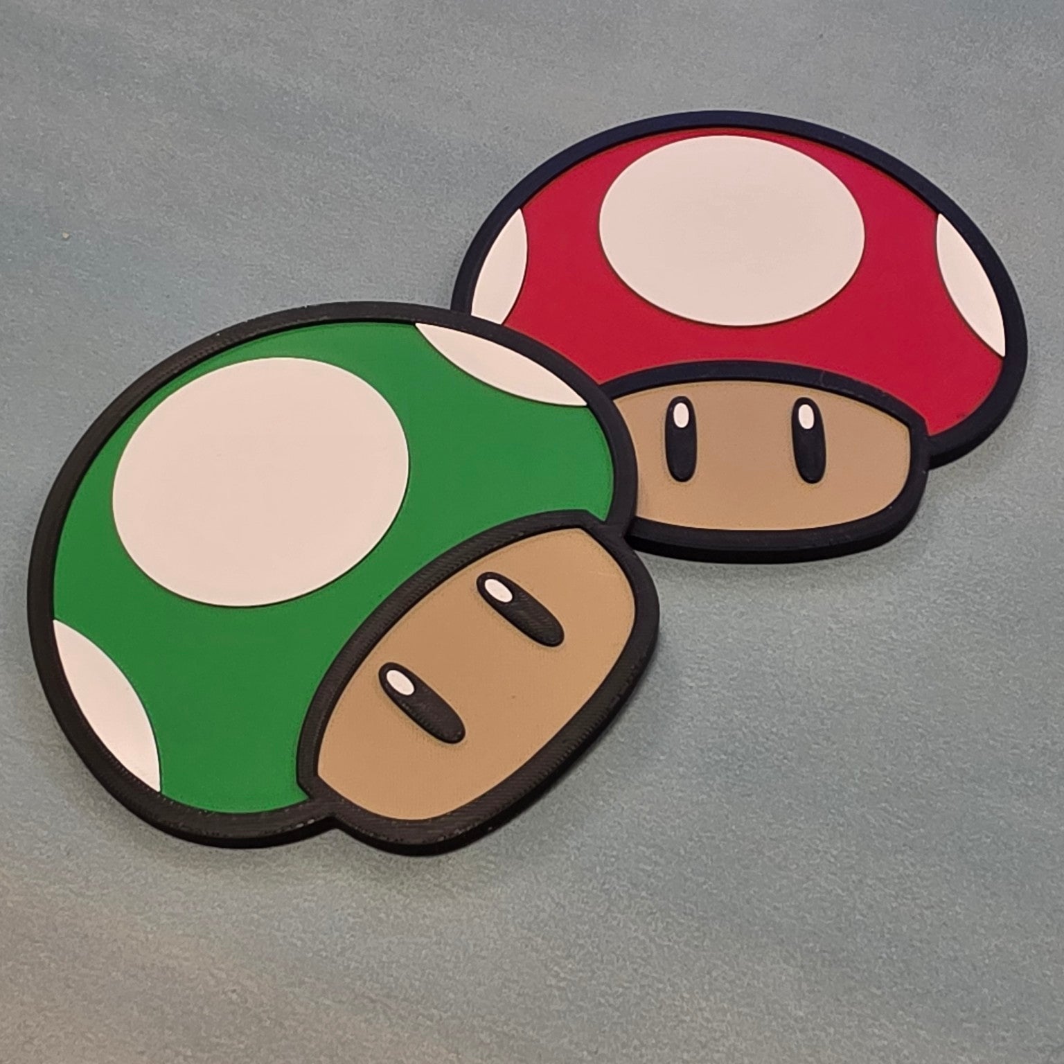 Green and red mushroom inspired 3D printed signs