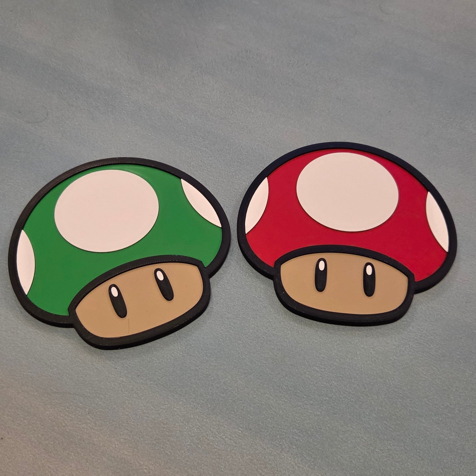 Red and green mushroom inspired gaming signs side by side